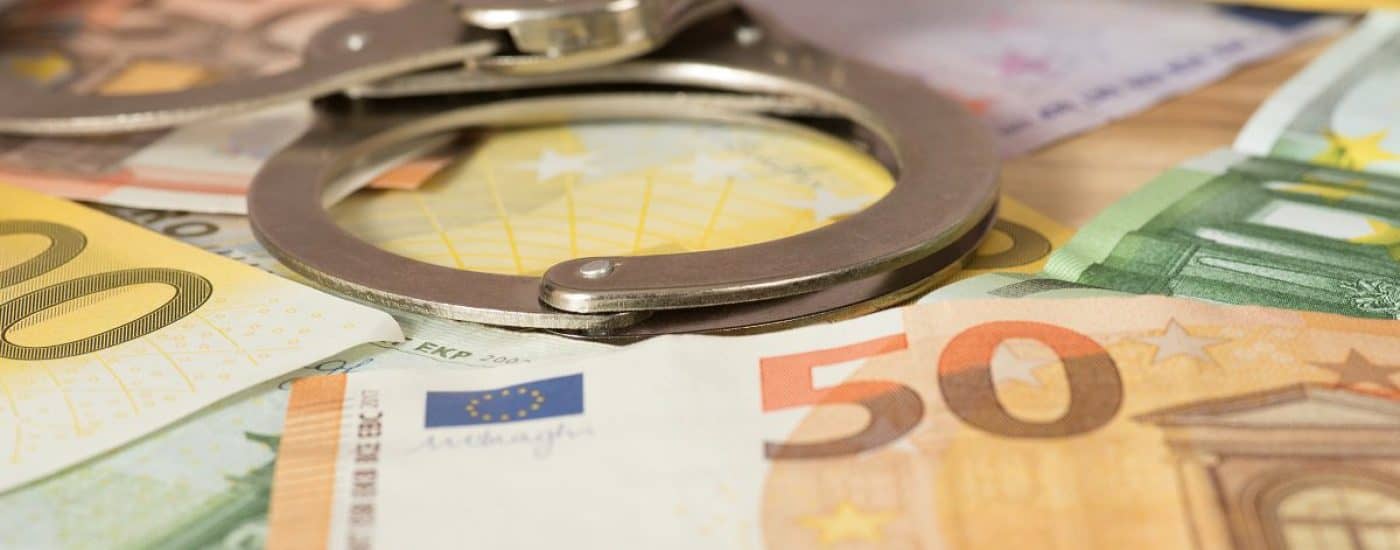 Handcuffs and Euro banknotes